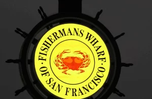 Fisherman’s Wharf sign illuminated at night during a San Francisco Jeep sightseeing tour