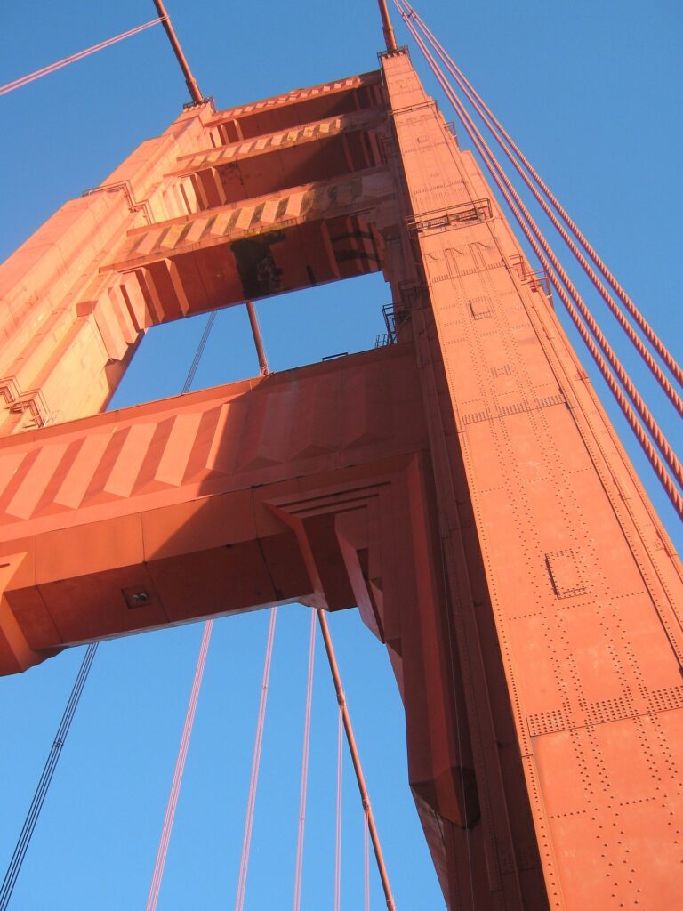 View up the Golden Gate Bridge tower. 754 feet tall painted in International Orange. 