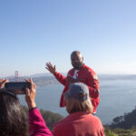 San Francisco Jeep tour guide talking with guests at the Marin Headlands overlooking the Golden Gate Bridge