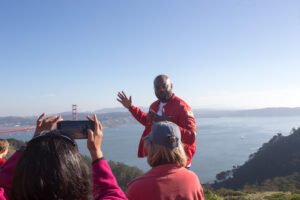 San Francisco Jeep tour guide talking with guests at the Marin Headlands overlooking the Golden Gate Bridge