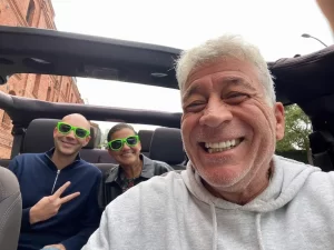 Tour guide Jo-Jo and two guests smiling inside an open-air Jeep, ready to begin a San Francisco sightseeing tour