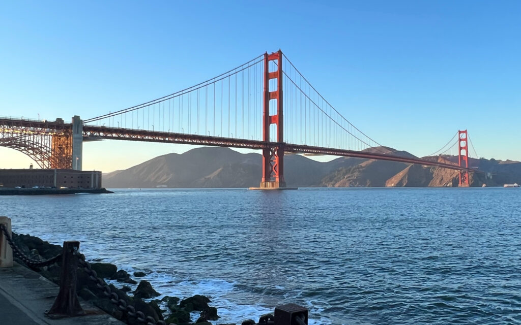 Golden Gate Bridge towering over San Francisco Bay withn the Marin Headlands in the background