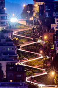 Lombard Street in San Francisco illuminated at night during a Jeep sightseeing tour