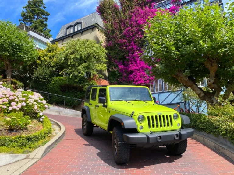 sightseeing tour down Lombard Street the crookedest street aboard San Francisco Jeep Tours