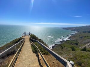 Guests taking photos at Muir Beach Overlook during a private tour from San Francisco