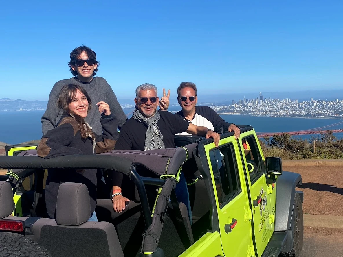 Tour Guests Enjoying Marin Headlands and Hawk Hill Views on a Private Jeep Tour Tour guests riding in an open-air Jeep enjoying views from the Marin Headlands and Hawk Hill during a private San Francisco sightseeing tour