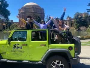 Sightseeing tour guests at the Palace of Fine Arts on board San Francisco private group Jeep Tours
